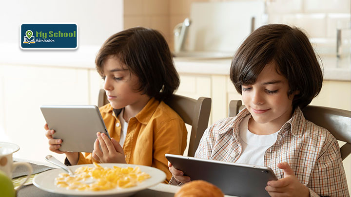 Child using a tablet under parental supervision for educational screen time.